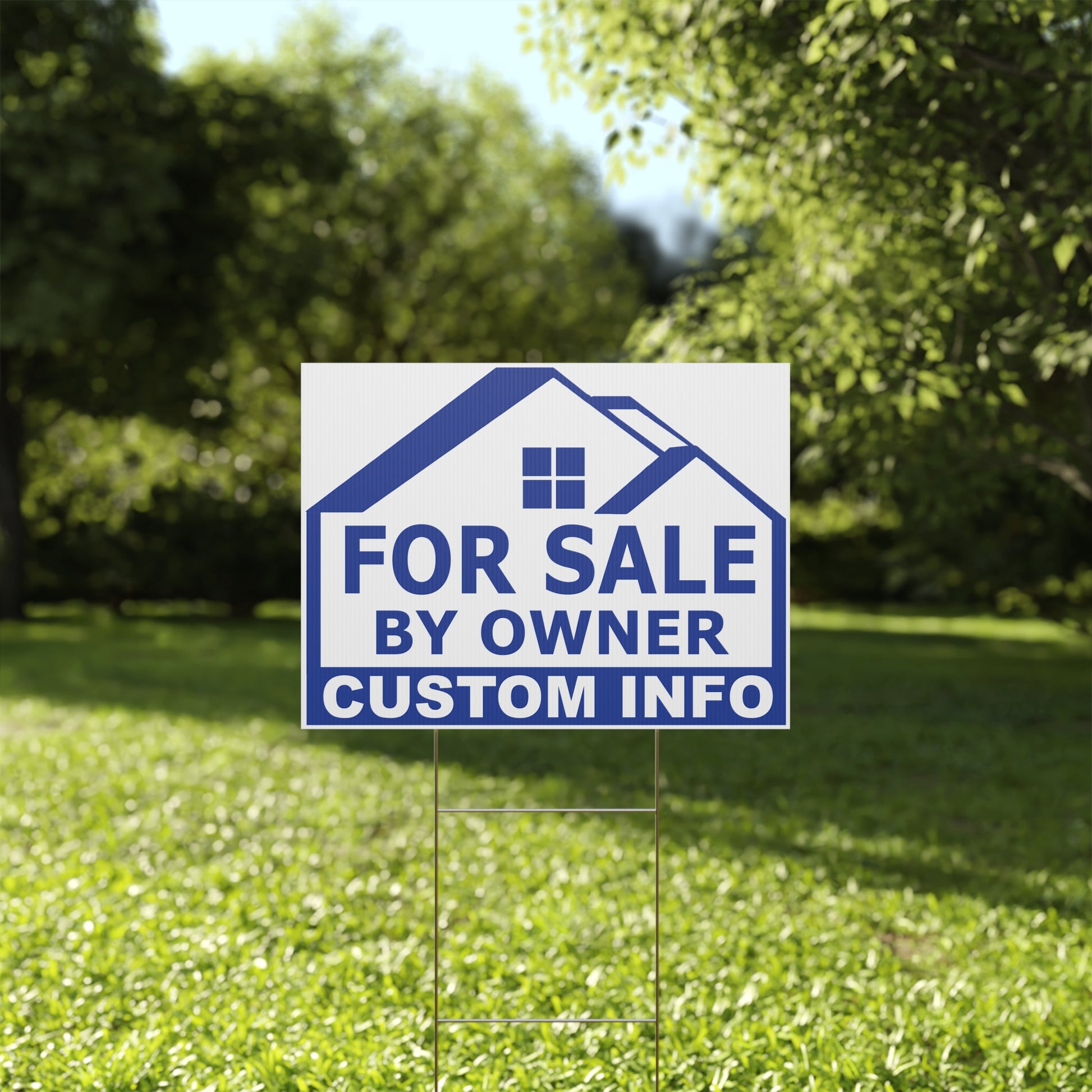 For Sale by Owner sign on a grassy lawn with trees in the background