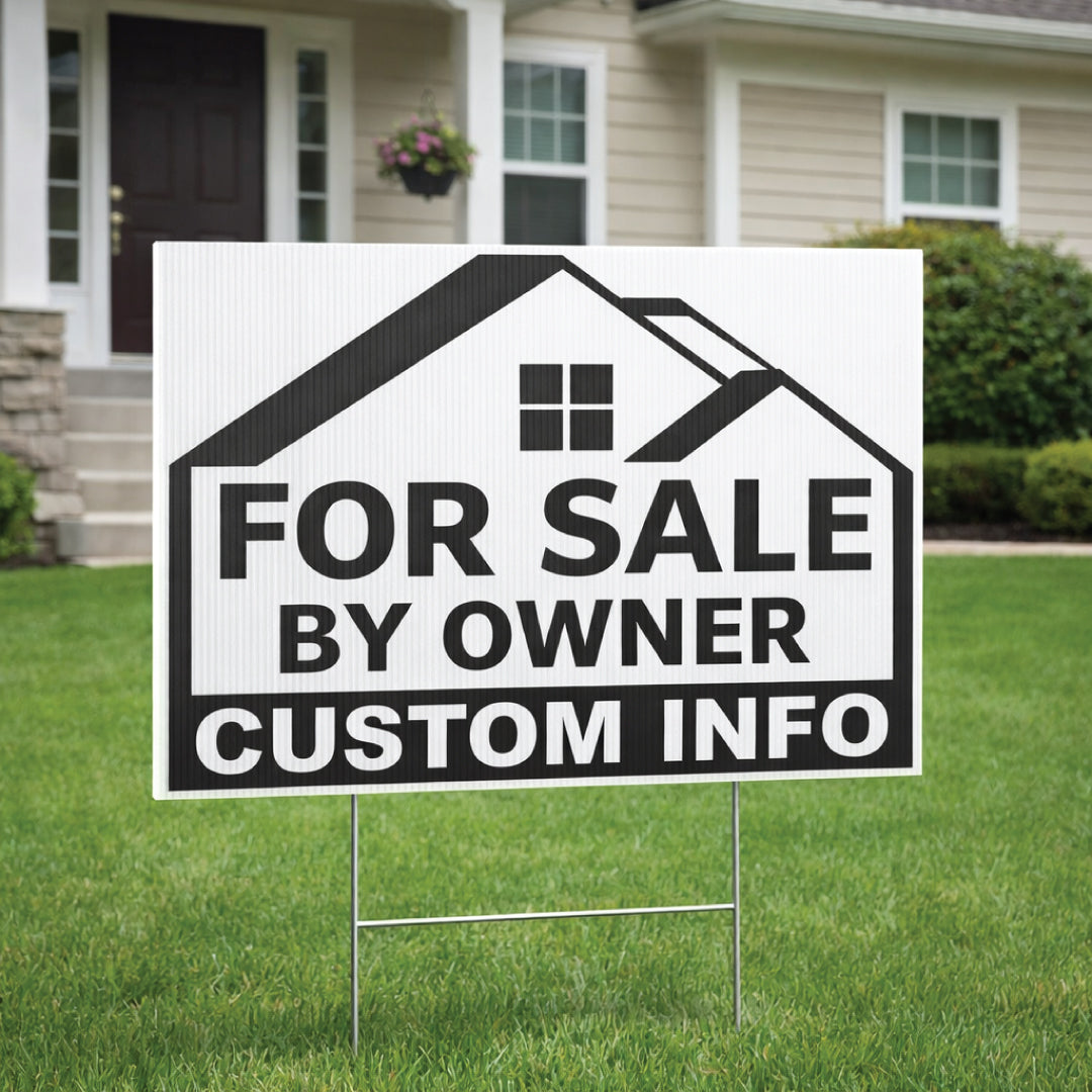 For Sale by Owner sign in front of a house