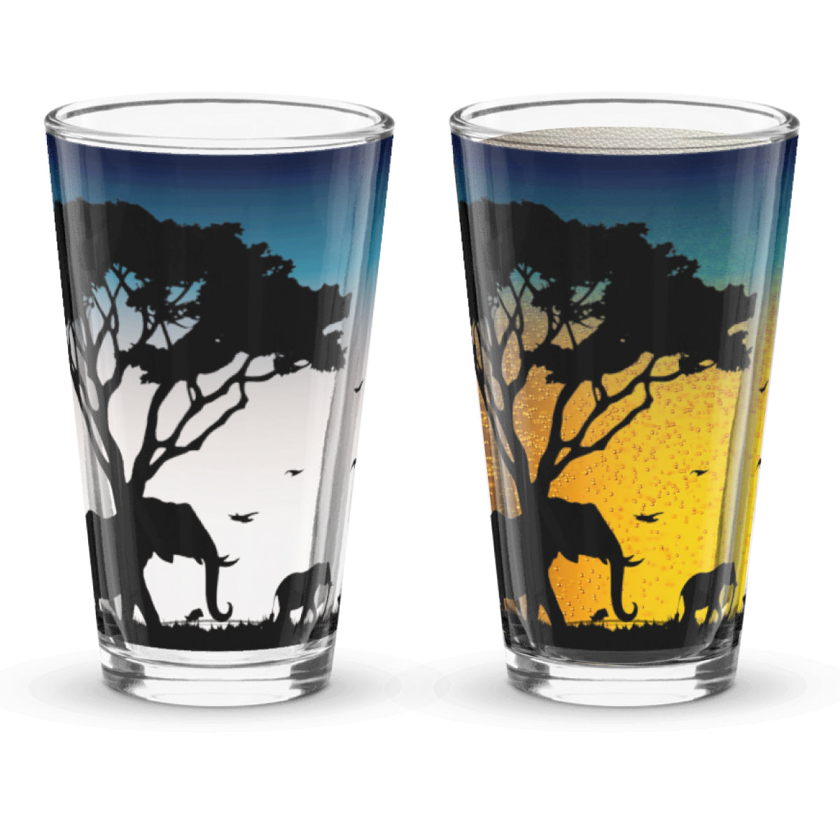 Two glasses with African landscape designs featuring elephants and trees. Designed on sunset background when beer is poured into the glass.