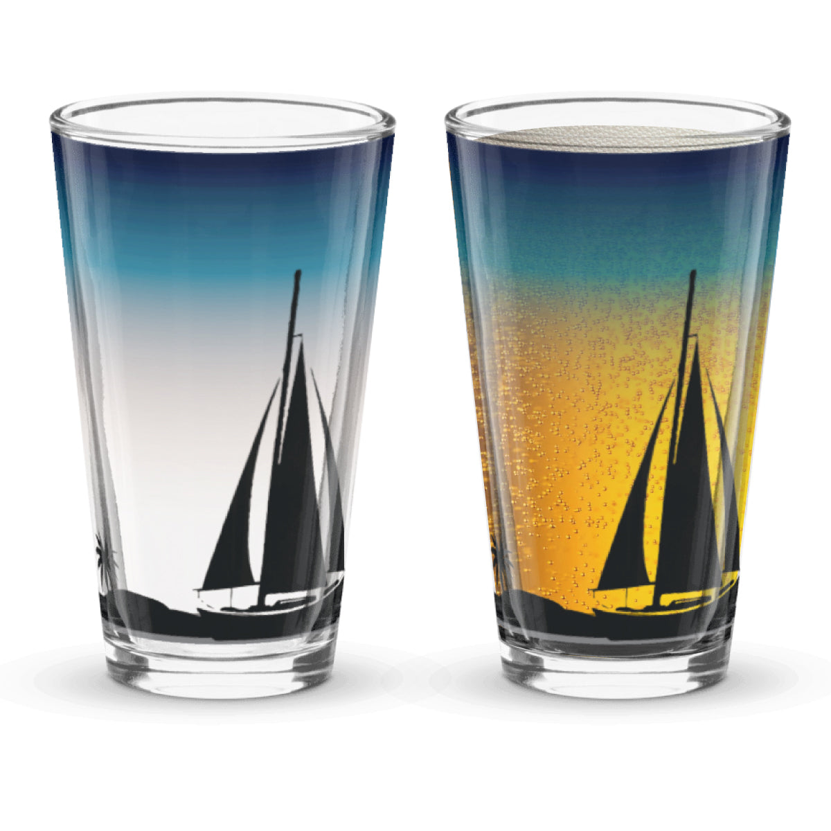 Two glasses with sailboat design on a sunset background when beer is poured into the glass.