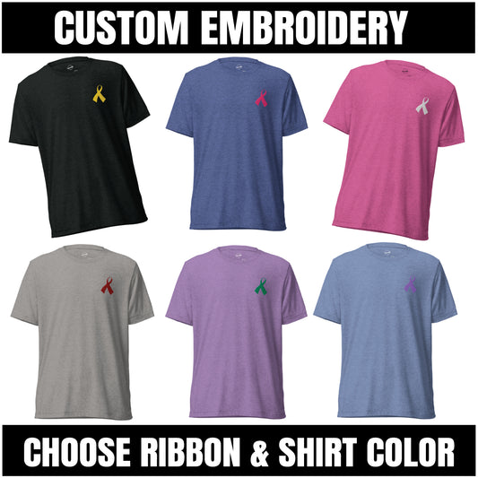 Collection of customizable t-shirts with embroidered ribbons in various colors on a white background.