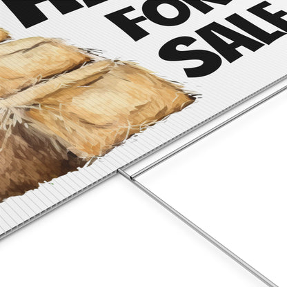 Close-up of a 'Hay For Sale' sign with a haystack  on a white background